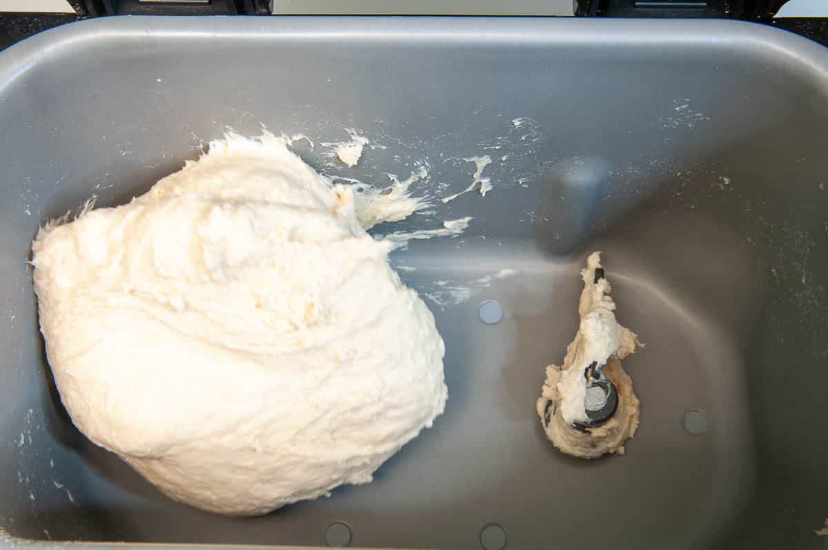 dough should stick to the sides, then pull away cleanly..