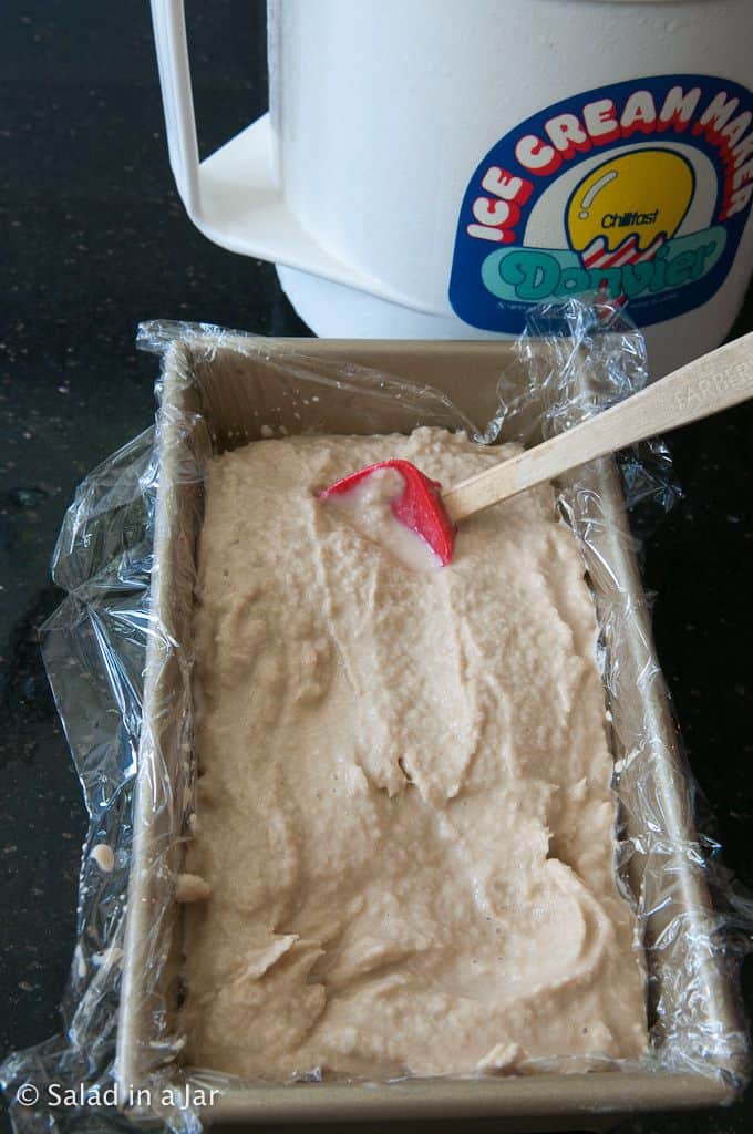 packing ice cream into loaf pan before putting into the freezer.