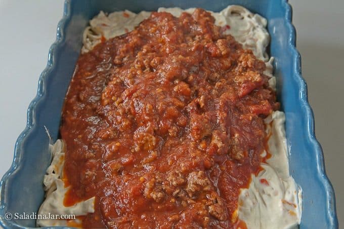 Layer of sauce over the cream cheese.