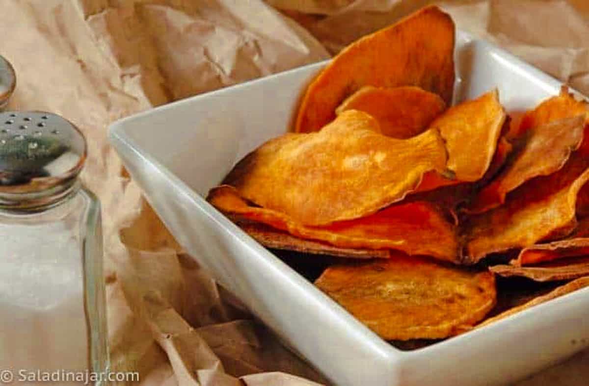 baked sweet potato chips in a small serving bowl.