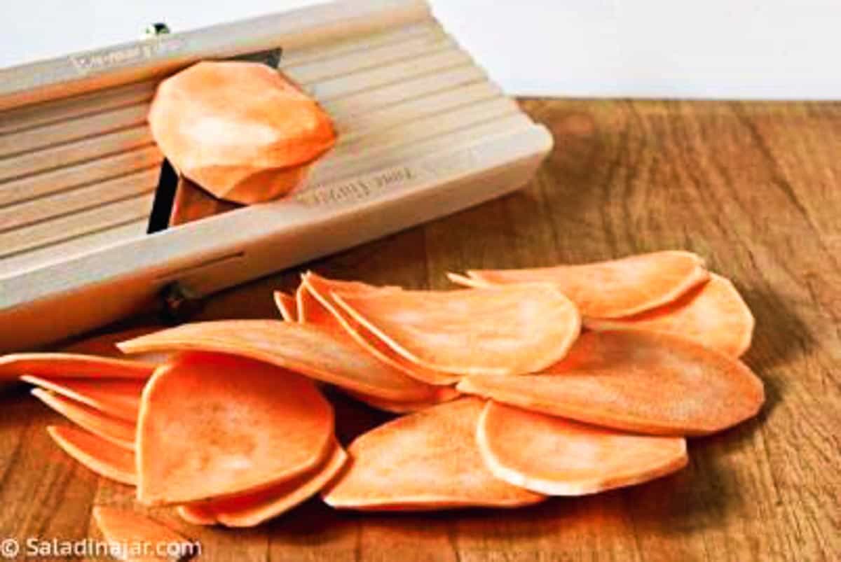 slicing sweet potatoes with a mandolin