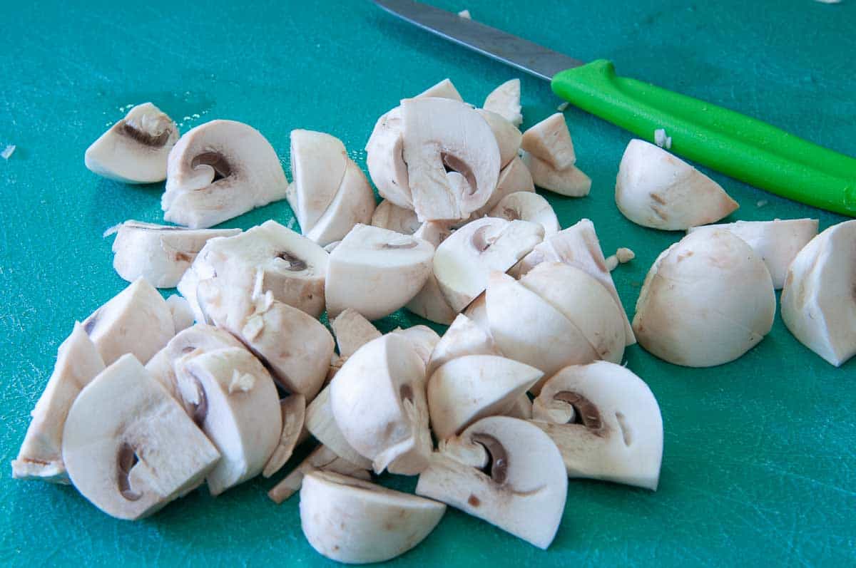 mushrooms cut in quarters or eighths.