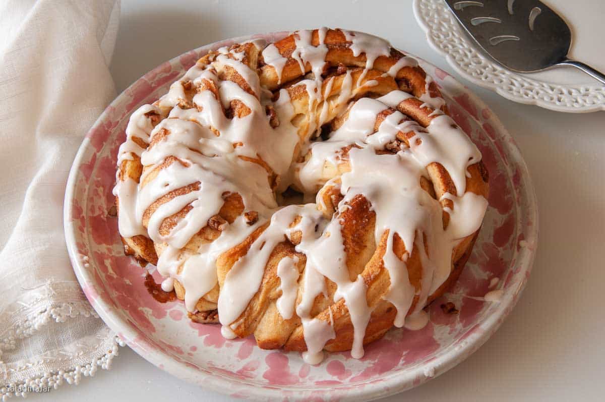 baked cinnamon twist drizzled with icing.