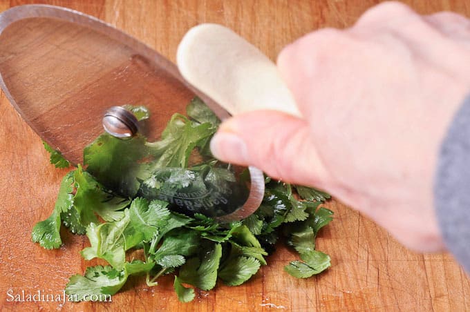 chopping cilantro with a pizza wheel
