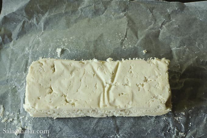 shaping the dough into a rectangle.