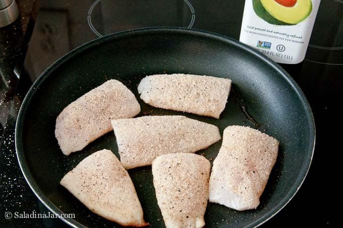 Breaded fish in skillet