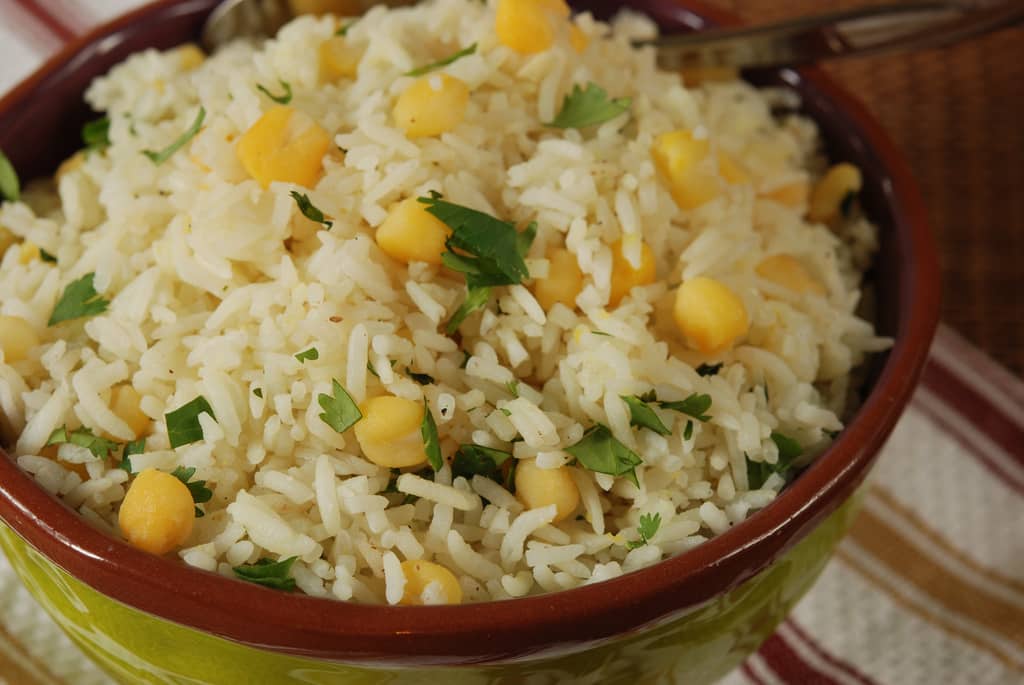 bowl of cooked cilantro rice with hominy