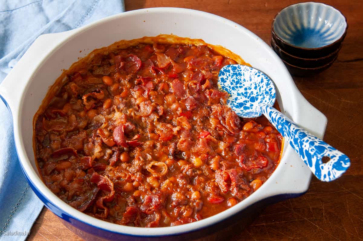 Baked beans with sausage and ground beef in a serving dish after baking