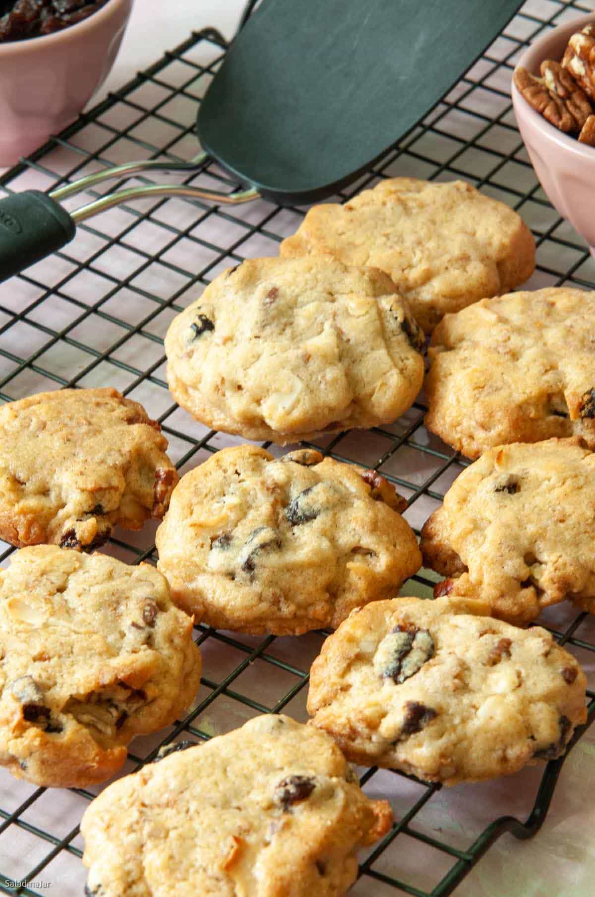 raisin bran cookies cookies on a cooling rack with a black spatula in the background