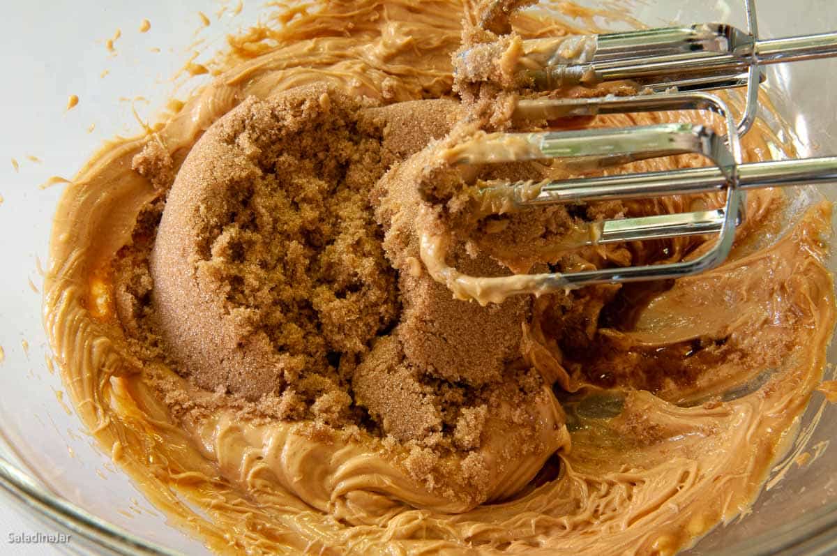 adding brown sugar to butter mixture