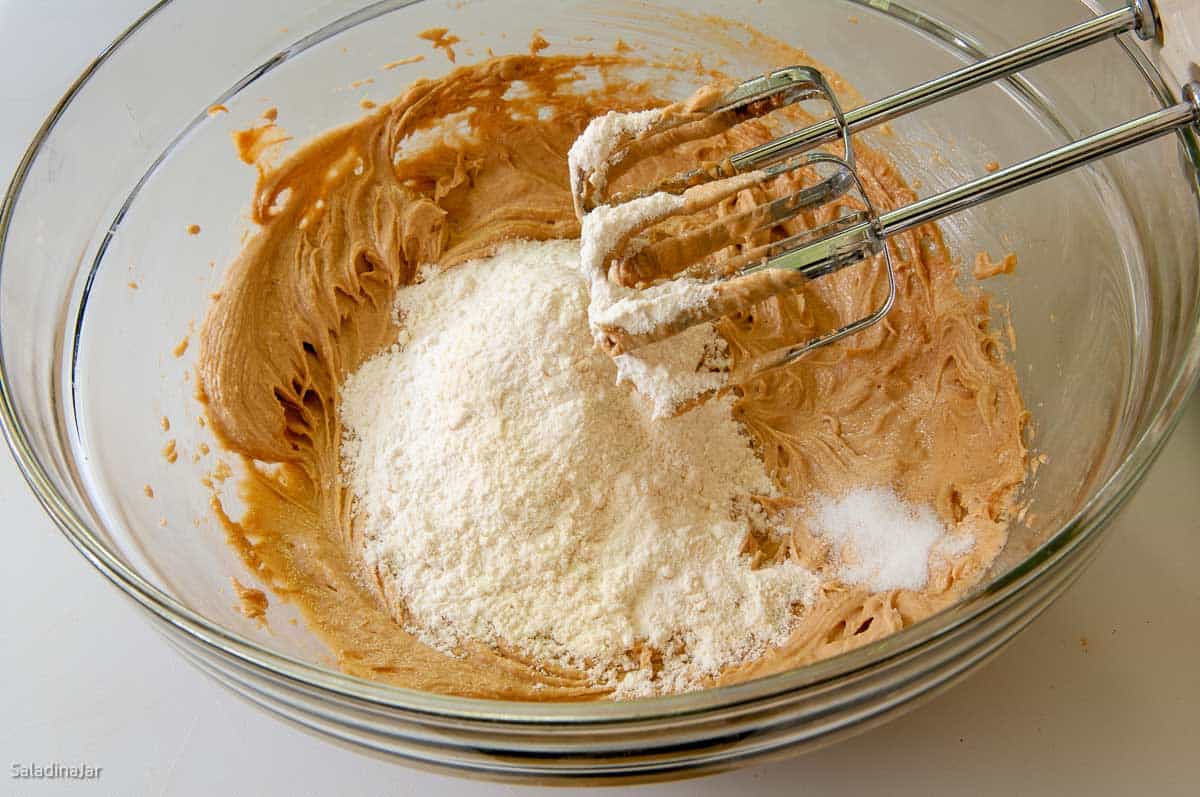 Adding flour and salt to cookies