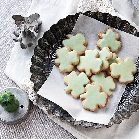 Shamrock Shortbread Cookies - Plate of frosted green shamrock shortbread cookies