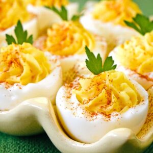 deviled eggs displayed on a deviled egg plate.