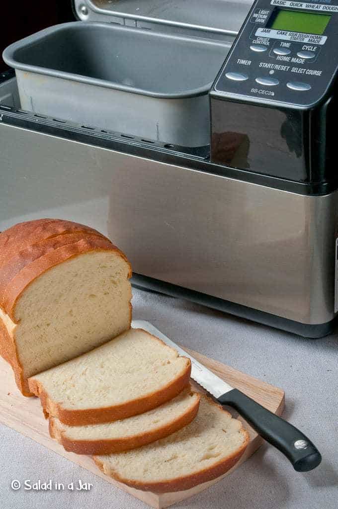 bread machine with sliced bread sitting in front of it