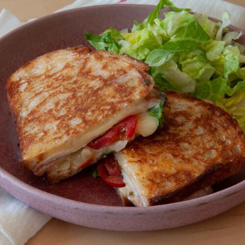 Smoked turkey melt on a plate.