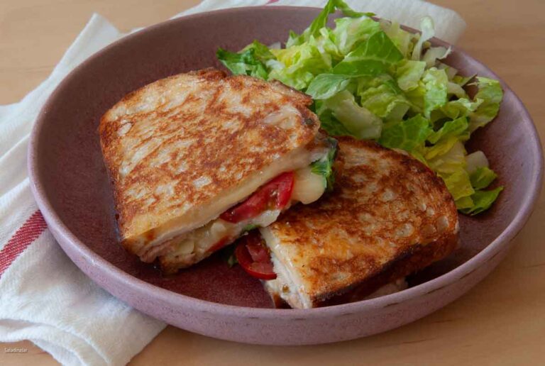 Smoked turkey melt on a plate.