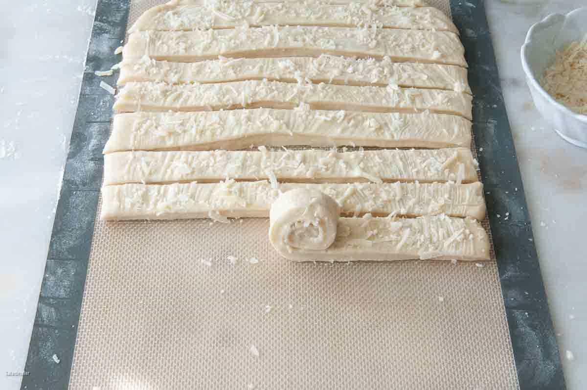 Rolling up the strips to make rolls.