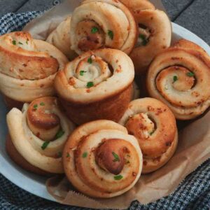 Soft bread rolls with potatoes, truffle oil, and Parmesan in a bread bowl.