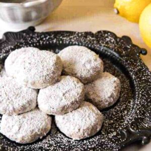 Lemon Snowdrop cookies displayed on a plate.