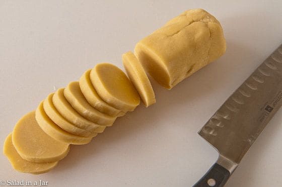 Slicing the tart dough into 14 discs.