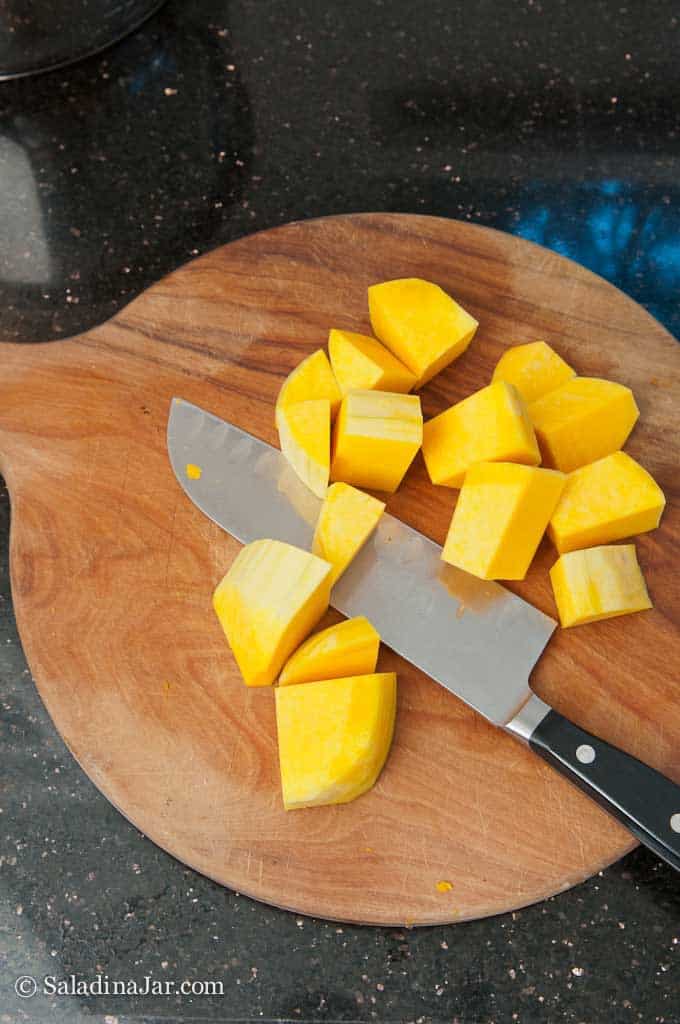 cutting up fresh butternut squash