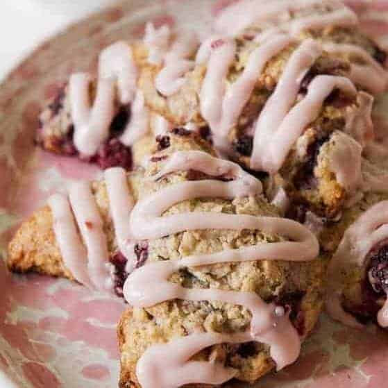 Iced Blackberry Scones on a serving plate.