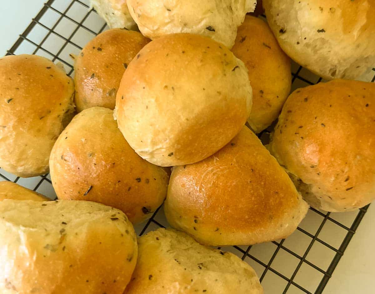 baked herb rolls on cooling rack