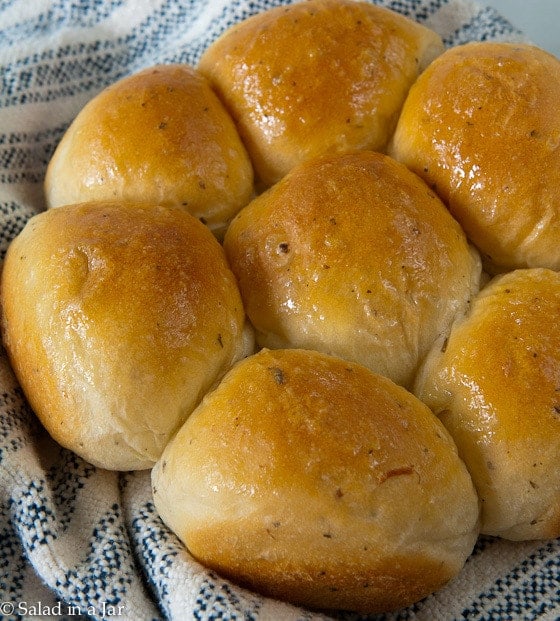 Herb and Garlic Dinner Rolls on a towel.