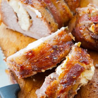 Bacon-Wrapped Stuffed Pork Tenderloin with Raspberry Chipotle Sauce