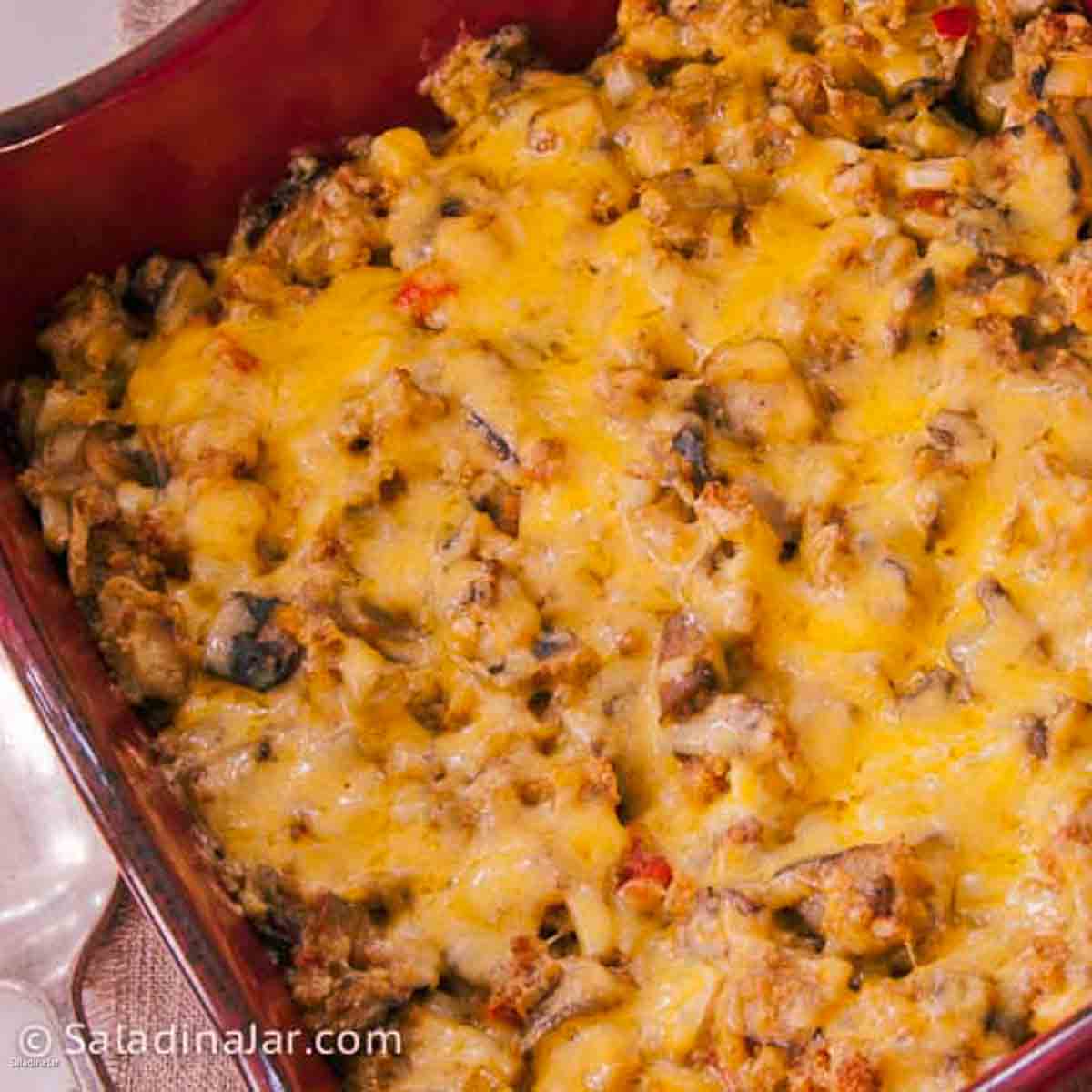 baked southwestern Eggplant Dressing covered with melted cheese