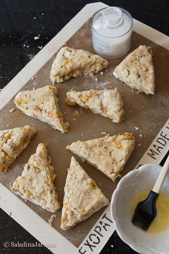 finishing scones with sugar before baking