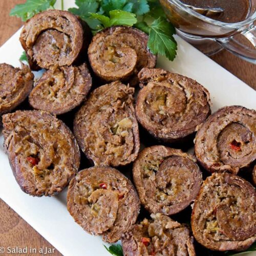 Sliced Stuffed London Broil on a serving platter