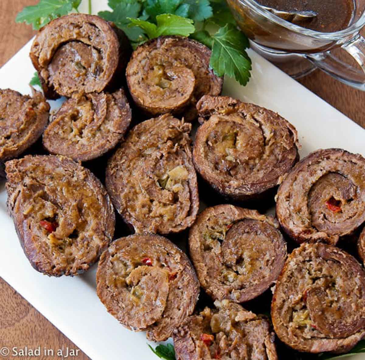 Sliced Stuffed London Broil on a serving platter