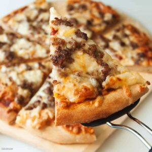 whole wheat pizza dough made in a bread machine--showing baked slice.