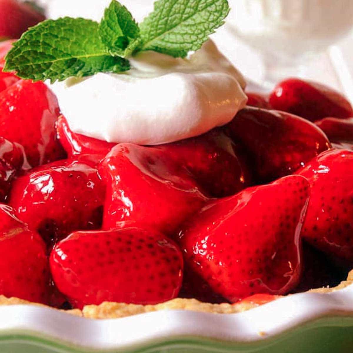Fresh Strawberry pie with glaze containing Jello in pie dish