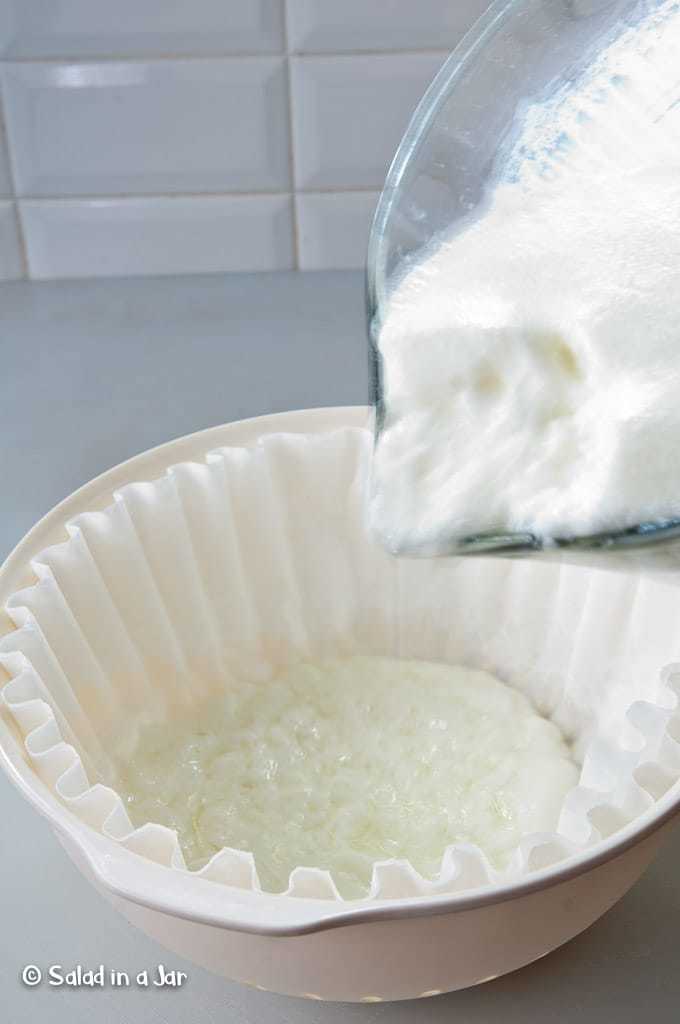 preparing yogurt to strain using coffee filters