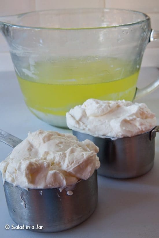 two cups Icelandic yogurt sitting next to whey