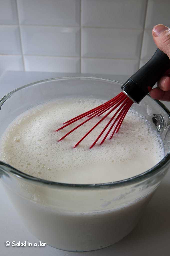 Whisking starter into cooled yogurt