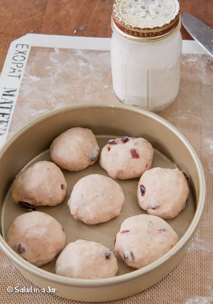 formed dinner rolls in baking pan before rising