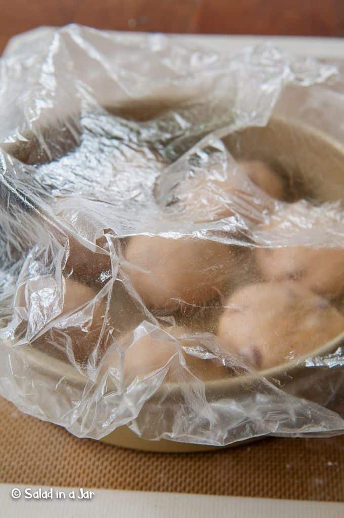 dinner rolls proofing while covered with a cheap shower cap