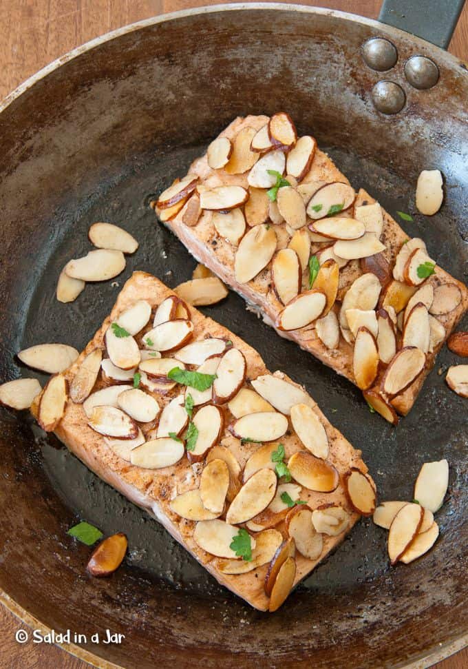 almond-covered salmon in a skillet