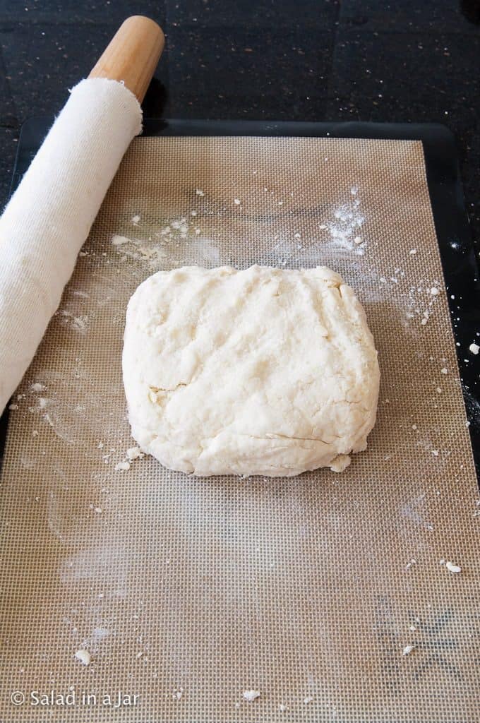 Press dough together. Knead 3 or 4 times. Press into a rough square.