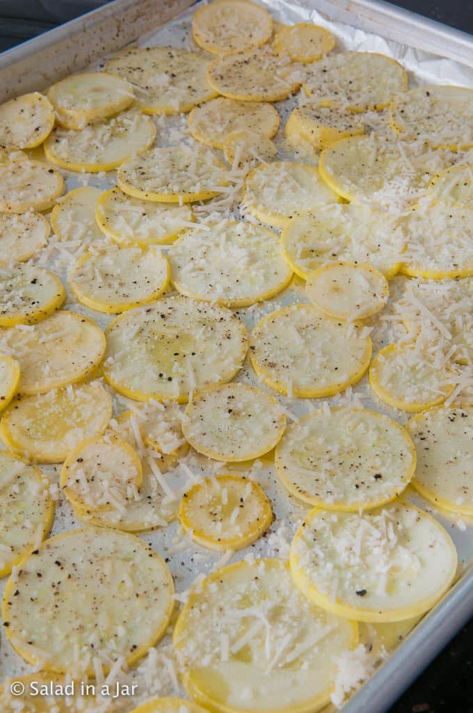 raw yellow squash sprinkled with Parmesan