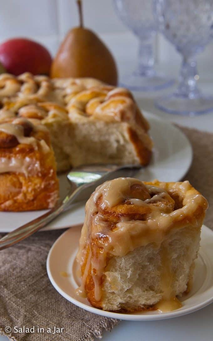 one baked cinnamon roll pulled away from the others