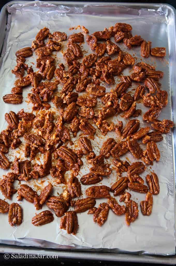 Spread pecans out evenly on a foil-covered cookie sheet.
