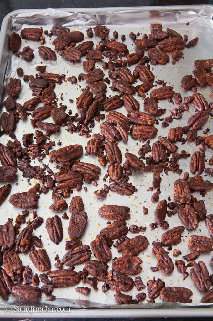 Baked spicy pecans on cookie sheet