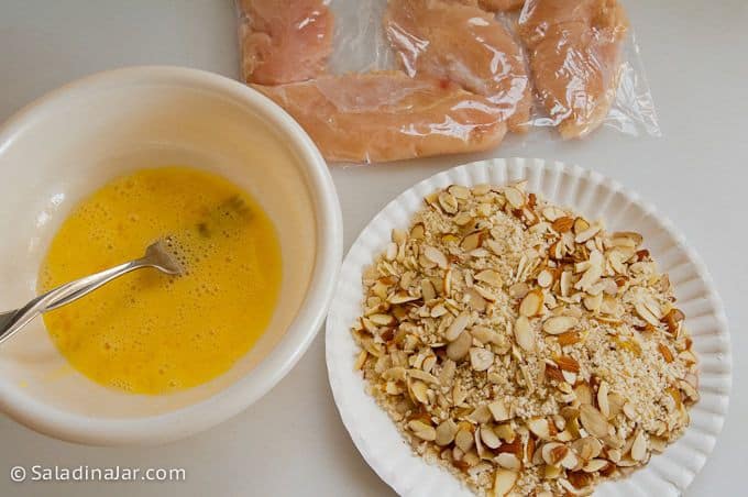 Preparing to bread chicken tenderloins