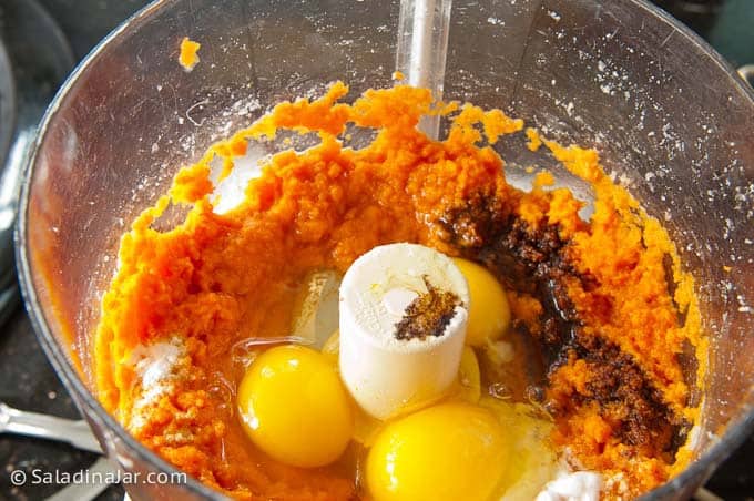 adding remaining ingredients to pureed carrots