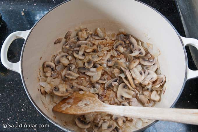 cooking mushrooms and onions.