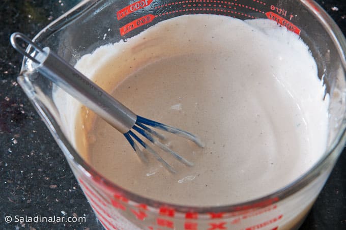 sour cream and hot broth mixture whisked together